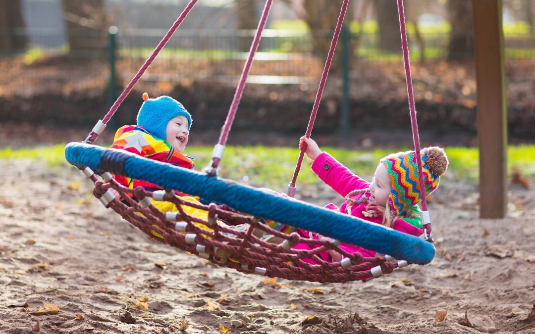 Kids on playground swing