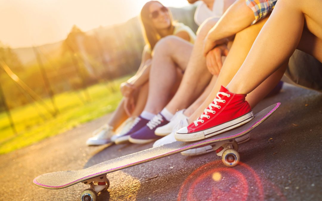 Young peoples legs with skateboard