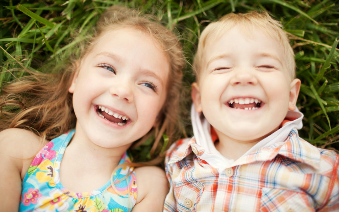 Sister and brother kids laughing